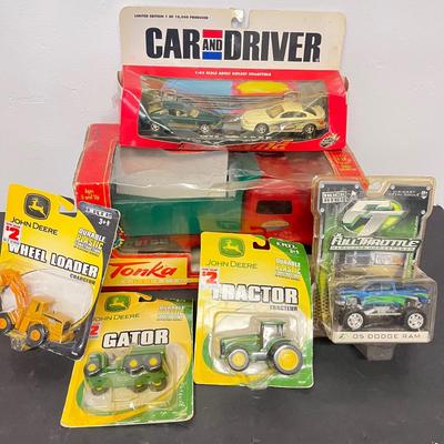 LOT 125: Various Vehicle Toys in Original Packaging - John Deere, Tonka and More