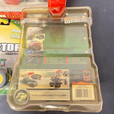 LOT 125: Various Vehicle Toys in Original Packaging - John Deere, Tonka and More