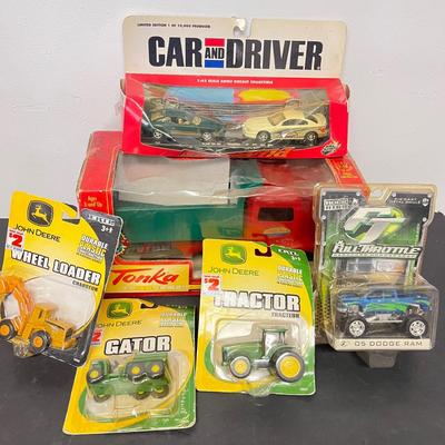 LOT 125: Various Vehicle Toys in Original Packaging - John Deere, Tonka and More