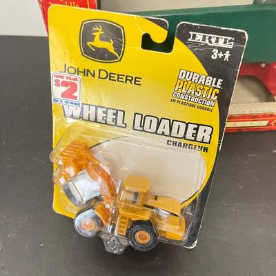 LOT 125: Various Vehicle Toys in Original Packaging - John Deere, Tonka and More