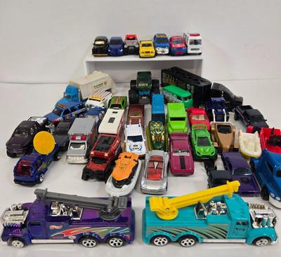 LOT 178: HotWheels Crane Trucks, Rock on Wheels Truck, and More