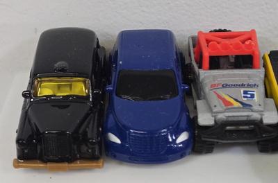LOT 178: HotWheels Crane Trucks, Rock on Wheels Truck, and More