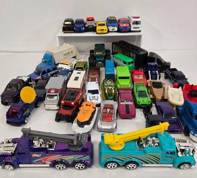 LOT 178: HotWheels Crane Trucks, Rock on Wheels Truck, and More