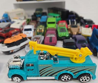 LOT 178: HotWheels Crane Trucks, Rock on Wheels Truck, and More