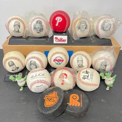 LOT 183: Philadelphia Sports Collection - Phillies Baseballs, Flyers Hockey Pucks