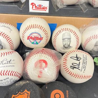 LOT 183: Philadelphia Sports Collection - Phillies Baseballs, Flyers Hockey Pucks