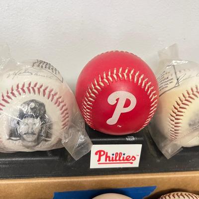 LOT 183: Philadelphia Sports Collection - Phillies Baseballs, Flyers Hockey Pucks