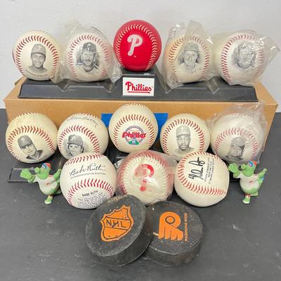 LOT 183: Philadelphia Sports Collection - Phillies Baseballs, Flyers Hockey Pucks
