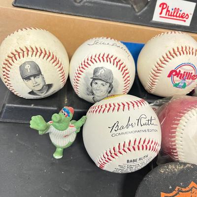 LOT 183: Philadelphia Sports Collection - Phillies Baseballs, Flyers Hockey Pucks