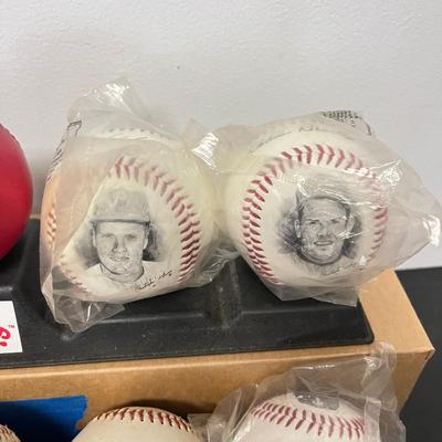 LOT 183: Philadelphia Sports Collection - Phillies Baseballs, Flyers Hockey Pucks