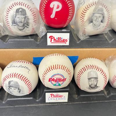 LOT 183: Philadelphia Sports Collection - Phillies Baseballs, Flyers Hockey Pucks