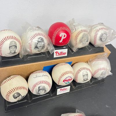 LOT 183: Philadelphia Sports Collection - Phillies Baseballs, Flyers Hockey Pucks