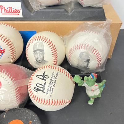 LOT 183: Philadelphia Sports Collection - Phillies Baseballs, Flyers Hockey Pucks