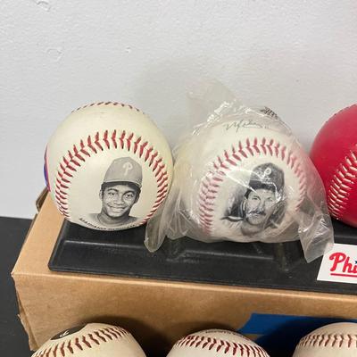 LOT 183: Philadelphia Sports Collection - Phillies Baseballs, Flyers Hockey Pucks