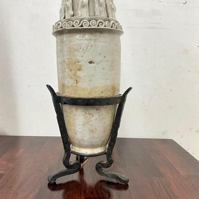 Sale Photo Thumbnail #96: . Funerary urns of this type, known as hunping (or "jar for the soul"), were often placed in tombs to provide a resting place for the deceased's soul.  does not come with shades, some tips around top are broken
Both measure: 31" high on wrought Iron Base