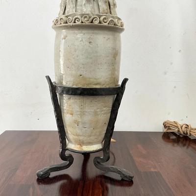 Sale Photo Thumbnail #97: . Funerary urns of this type, known as hunping (or "jar for the soul"), were often placed in tombs to provide a resting place for the deceased's soul.  does not come with shades, some tips around top are broken
Both measure: 31" high on wrought Iron Base