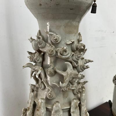 Sale Photo Thumbnail #92: . Funerary urns of this type, known as hunping (or "jar for the soul"), were often placed in tombs to provide a resting place for the deceased's soul.  does not come with shades, some tips around top are broken
Both measure: 31" high on wrought Iron Base