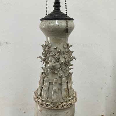Sale Photo Thumbnail #94: . Funerary urns of this type, known as hunping (or "jar for the soul"), were often placed in tombs to provide a resting place for the deceased's soul.  does not come with shades, some tips around top are broken
Both measure: 31" high on wrought Iron Base