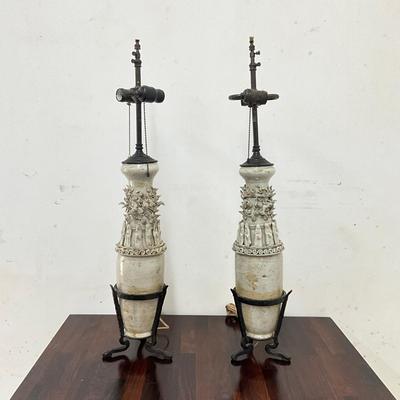 Sale Photo Thumbnail #90: . Funerary urns of this type, known as hunping (or "jar for the soul"), were often placed in tombs to provide a resting place for the deceased's soul.  does not come with shades, some tips around top are broken
Both measure: 31" high on wrought Iron Base