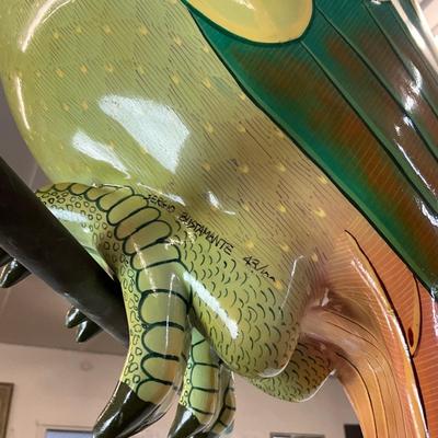 Sale Photo Thumbnail #193: Made of thick heavy papier-mâché with thick gloss and paint placed on copper perch 
Estimated $1200-$2000
measures 32" high from beak to tail 
body width is 9" 
body depth is 23" (beak to body)
perch is 22.5" wide x 26.5" high (copper) 
bottom of tail h