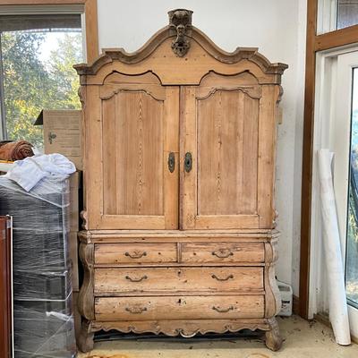 Sale Photo Thumbnail #244: Has spotted black molds, seven drawers, three shelves, hand carved face motif, floral wallpaper, top comes apart in three sections
Measures: 7'6" high x 56" wide x 21.5" deep