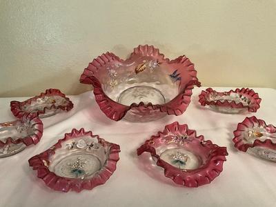 Sale Photo Thumbnail #82: Painted Art Cranberry brides bowl with dessert dishes
1 dish does have a raw edge size 1/4 in.