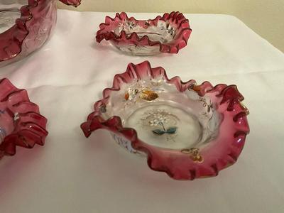Sale Photo Thumbnail #83: Painted Art Cranberry brides bowl with dessert dishes
1 dish does have a raw edge size 1/4 in.