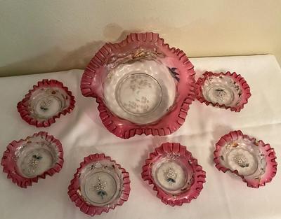 Sale Photo Thumbnail #81: Painted Art Cranberry brides bowl with dessert dishes
1 dish does have a raw edge size 1/4 in.