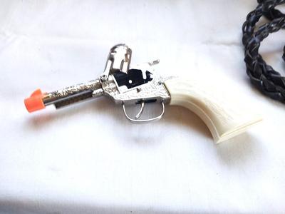 CAPGUN-LEATHER WHIP-KIDS BELT AND BUCKLE AND COLLECTERS CRAYONS