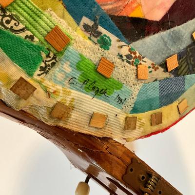 Sale Photo Thumbnail #491: Measures: 22.5" long x 14" wide x 17" high
Guitar wings have a collage mixed materials.