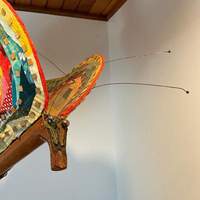 Sale Photo Thumbnail #488: Measures: 22.5" long x 14" wide x 17" high
Guitar wings have a collage mixed materials.