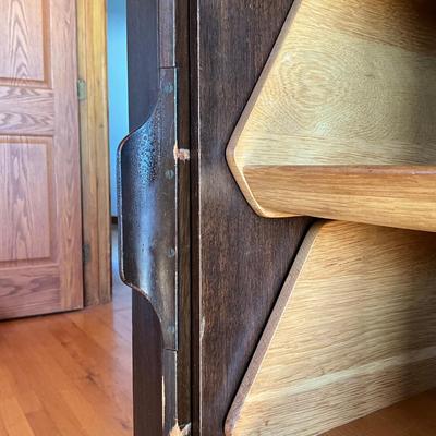 Sale Photo Thumbnail #541: Has adjustable shelves, has damage to front right and left corner, top is solid slate
Piece of veneer on the left bottom corner is coming off and it seems the feet have been replaced and are the original. Please refer to photos.
Measures: 6'7.5" wide x 22