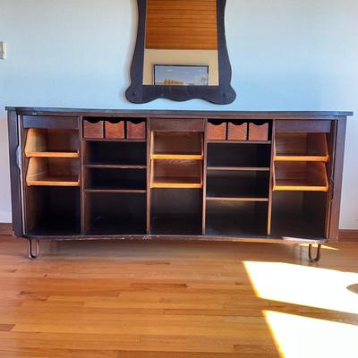 Sale Photo Thumbnail #548: Has adjustable shelves, has damage to front right and left corner, top is solid slate
Piece of veneer on the left bottom corner is coming off and it seems the feet have been replaced and are the original. Please refer to photos.
Measures: 6'7.5" wide x 22