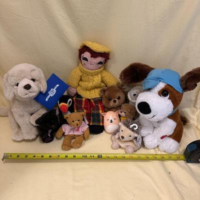 Sale Photo Thumbnail #565: Lot of Mixed Stuffed Animals- from new to gently loved. Hugs & Cuddles dog, breast cancer bear, Beanie Baby Penguin, Hedgehog, and what appears to be a handmade and knitted friend.