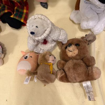 Sale Photo Thumbnail #571: Lot of Mixed Stuffed Animals- from new to gently loved. Hugs & Cuddles dog, breast cancer bear, Beanie Baby Penguin, Hedgehog, and what appears to be a handmade and knitted friend.