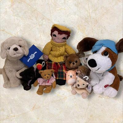 Sale Photo Thumbnail #564: Lot of Mixed Stuffed Animals- from new to gently loved. Hugs & Cuddles dog, breast cancer bear, Beanie Baby Penguin, Hedgehog, and what appears to be a handmade and knitted friend.