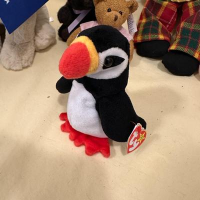Sale Photo Thumbnail #569: Lot of Mixed Stuffed Animals- from new to gently loved. Hugs & Cuddles dog, breast cancer bear, Beanie Baby Penguin, Hedgehog, and what appears to be a handmade and knitted friend.