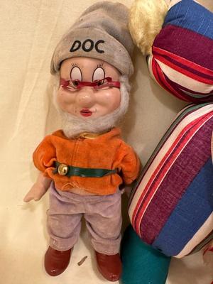 Sale Photo Thumbnail #642: Two Vintage Dolls, "Doc" from Snow White approx. 10" tall, Walt Disney and baby doll approx. 14" tall - both in good condition