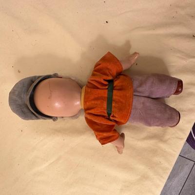 Sale Photo Thumbnail #637: Two Vintage Dolls, "Doc" from Snow White approx. 10" tall, Walt Disney and baby doll approx. 14" tall - both in good condition