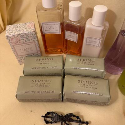 Sale Photo Thumbnail #829: Assorted Perfumes, Bottles, and Soaps/Body Care; much is Crabtree & Evelyn Spring Rain Scent plus assorted perfume bottles with varying amounts of perfume. And a dragonfly hair clip!