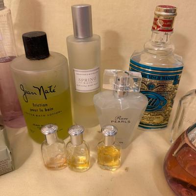 Sale Photo Thumbnail #830: Assorted Perfumes, Bottles, and Soaps/Body Care; much is Crabtree & Evelyn Spring Rain Scent plus assorted perfume bottles with varying amounts of perfume. And a dragonfly hair clip!