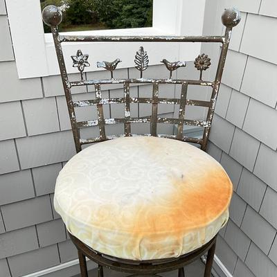 Sale Photo Thumbnail #679: Stools are heavily weathered, needs TLC. structurally sound , fresh paint and new seats and they will be good as new! 
Both measure: 45" high x 18" deep x 18" wide x 31" seat height
with ball tops and botanical theme of leaves, trees, birds on the back an