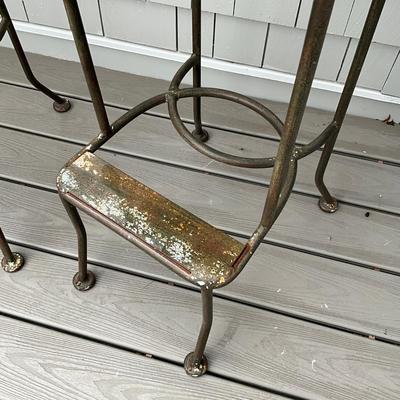 Sale Photo Thumbnail #677: Stools are heavily weathered, needs TLC. structurally sound , fresh paint and new seats and they will be good as new! 
Both measure: 45" high x 18" deep x 18" wide x 31" seat height
with ball tops and botanical theme of leaves, trees, birds on the back an