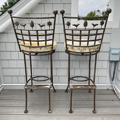 Sale Photo Thumbnail #676: Stools are heavily weathered, needs TLC. structurally sound , fresh paint and new seats and they will be good as new! 
Both measure: 45" high x 18" deep x 18" wide x 31" seat height
with ball tops and botanical theme of leaves, trees, birds on the back an
