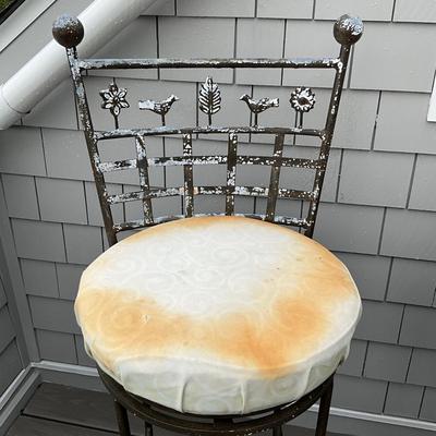 Sale Photo Thumbnail #680: Stools are heavily weathered, needs TLC. structurally sound , fresh paint and new seats and they will be good as new! 
Both measure: 45" high x 18" deep x 18" wide x 31" seat height
with ball tops and botanical theme of leaves, trees, birds on the back an