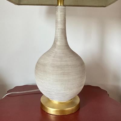 Sale Photo Thumbnail #731: Antique White resin lamp with gold accent base
Measures: 26.5" high x 9" diameter body