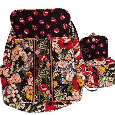 Sale Photo Thumbnail #922: Two Matching Vera Bradley Pieces Quilted Backpack with Front Pocket and Small Crossbody Clutch Bag 
Pattern appears ti be Poppy Fields. 
Excellent barely even used condition!
