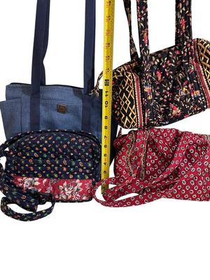 Sale Photo Thumbnail #980: Vera Bradley Lot 4 Handbags (yellow makeup bag in last photo)  & Blue Tote- these have all been visibly used to a good extent, they are in good shape but not impeccable.