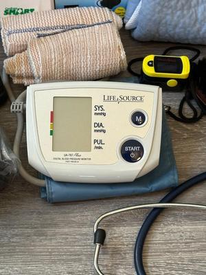 Sale Photo Thumbnail #1052: Good Health and Motility Tools Lot- 2 Study Canes, 2 BLood pressure monitors (untested), pillow, socks, alert monitor+