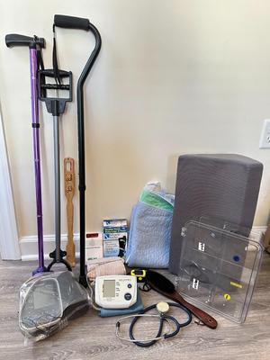 Sale Photo Thumbnail #1050: Good Health and Motility Tools Lot- 2 Study Canes, 2 BLood pressure monitors (untested), pillow, socks, alert monitor+